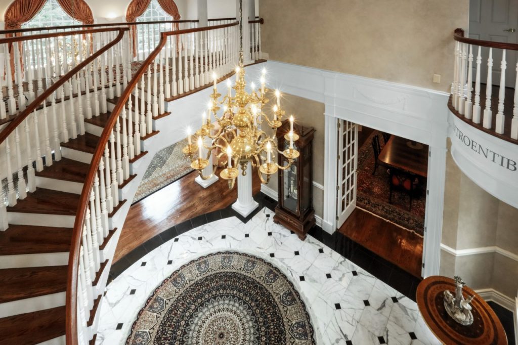 grand foyer remodel with spiral staircase