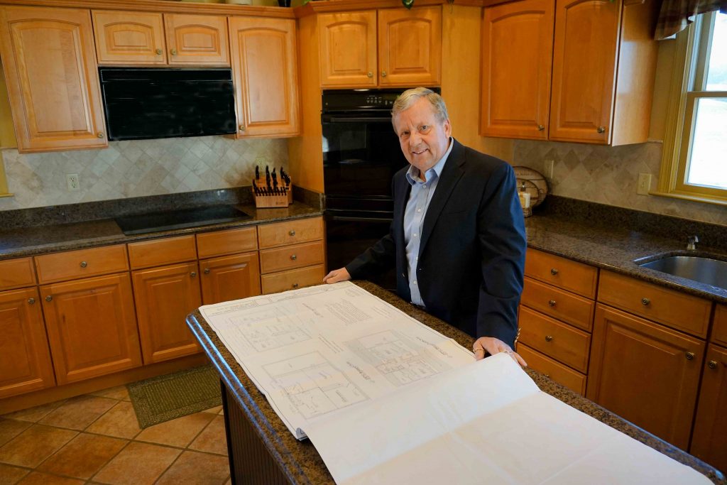 image of donald lynch jr in a kitchen with house layout plans