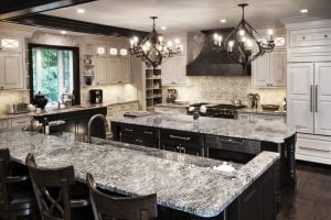 kitchen remodel with double chandelier, large kitchen island and granite countertops